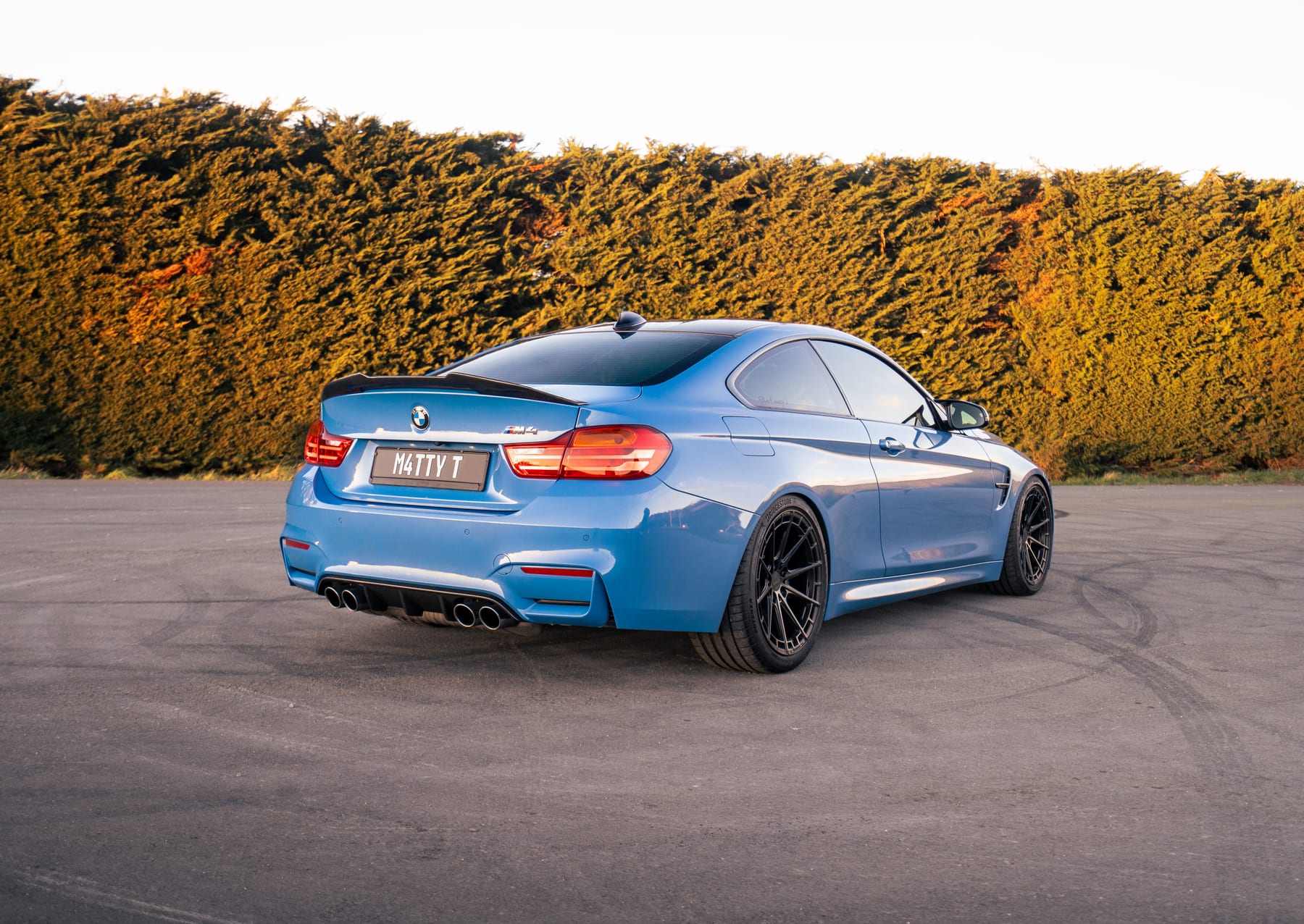 BMW M4 F82 in Yas Marina Blue, rear three quarter